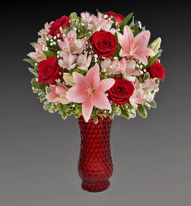 Key to My Heart Flowers - The key to an unforgettable Valentine’s Day. Red &amp; pink blooms are arranged in our luxurious ruby red vase. Featuring diamond cuts that brilliantly catch the light,