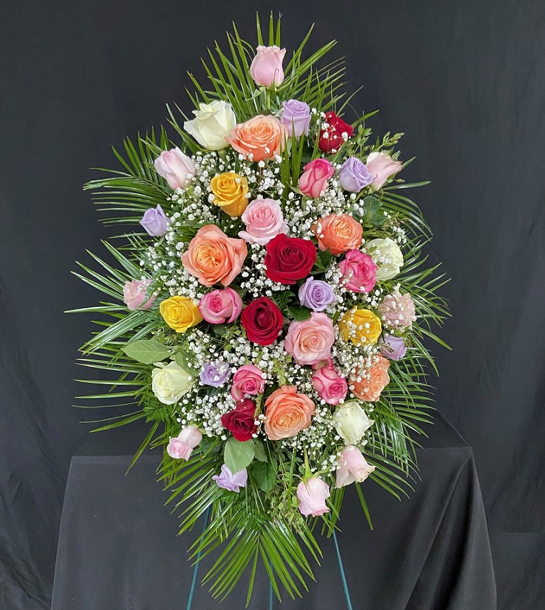 Rose Remembrance Standing Spray (Customizable) - An arrangement of 24 (Standard), 36 (Deluxe) [PICTURED], or 48 (Premium) colored roses displayed on a 4ft standing easel with mixed greens and baby's breath. This arrangement can be customized to your needs with a mixture of assorted colors or use specific color(s). Please call us directly to order if you have specific requests.