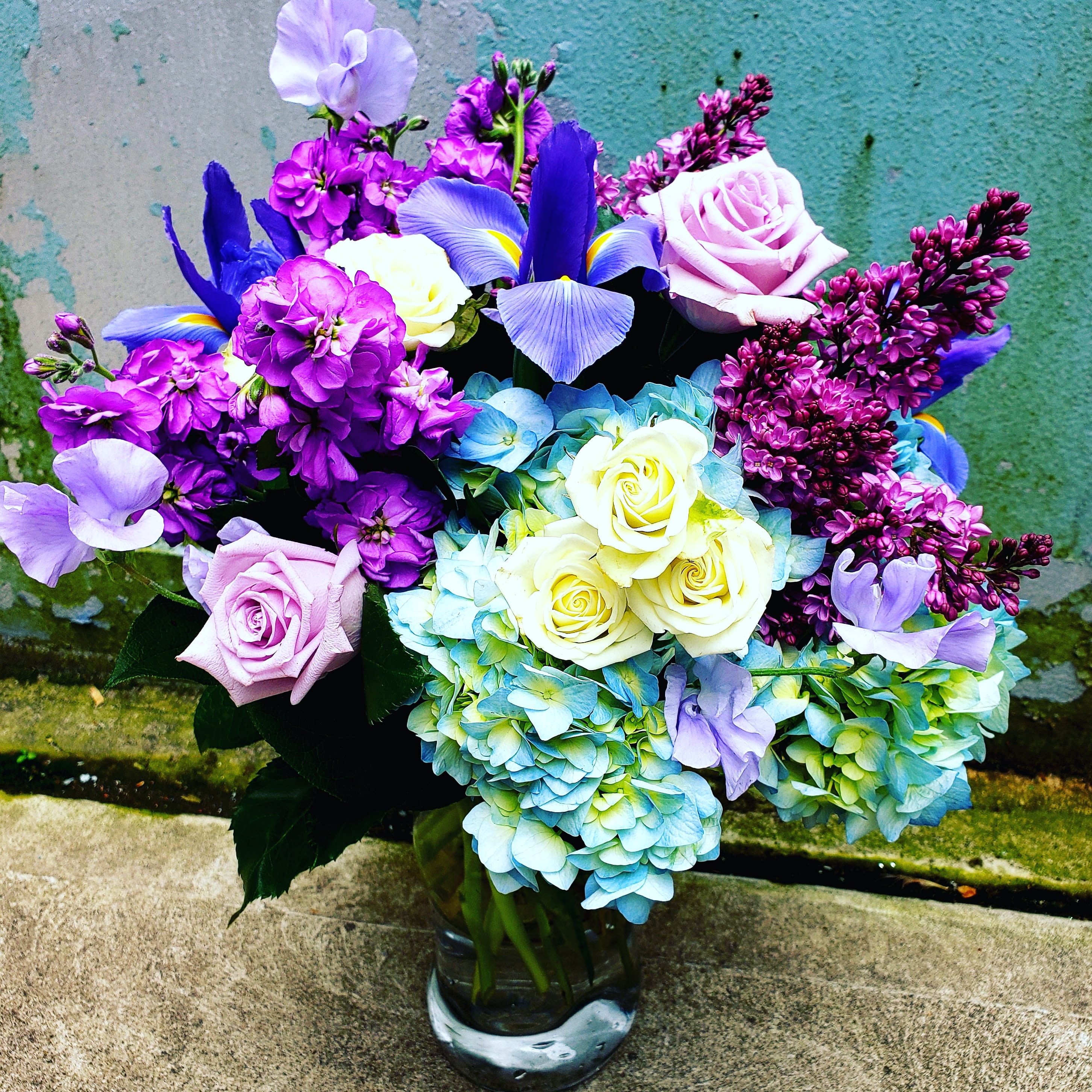 Sugar sweet - Shades of lavender periwinkle white and purple with locally grown fresh blooms on a classic vase