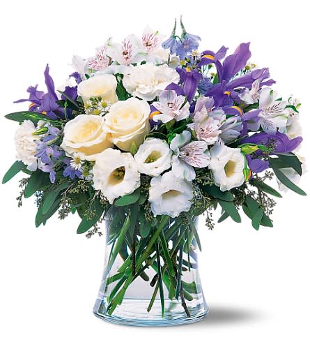 Blissful Bouquet - This serene bouquet of white and blue flowers will tell your loved one they make you feel like you''re on cloud nine.  Alstroemeria, carnations, delphinium, roses and iris delivered in a striking clear glass vase. Approximately 15&quot; W x 15&quot; H 