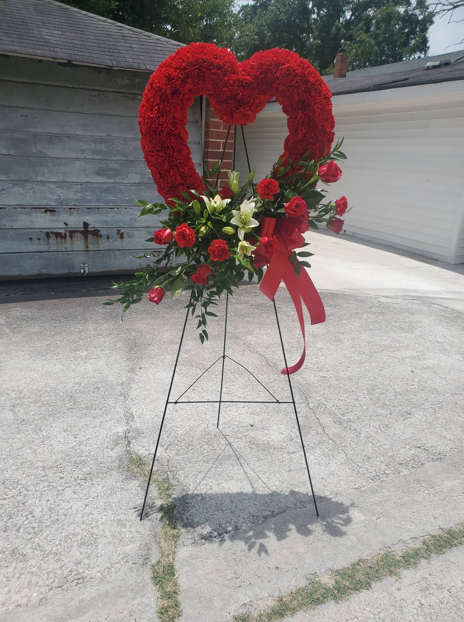 Red Sympathy Heart Red Sympathy Heart - This red carnation heart is a beautiful way to show sympathy for the lost loved one in your life.