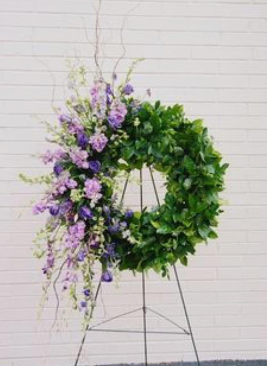 Side Wreath Side Wreath - Wreath filled with beautiful greenery with beautiful lavender stop and purple lisianthus