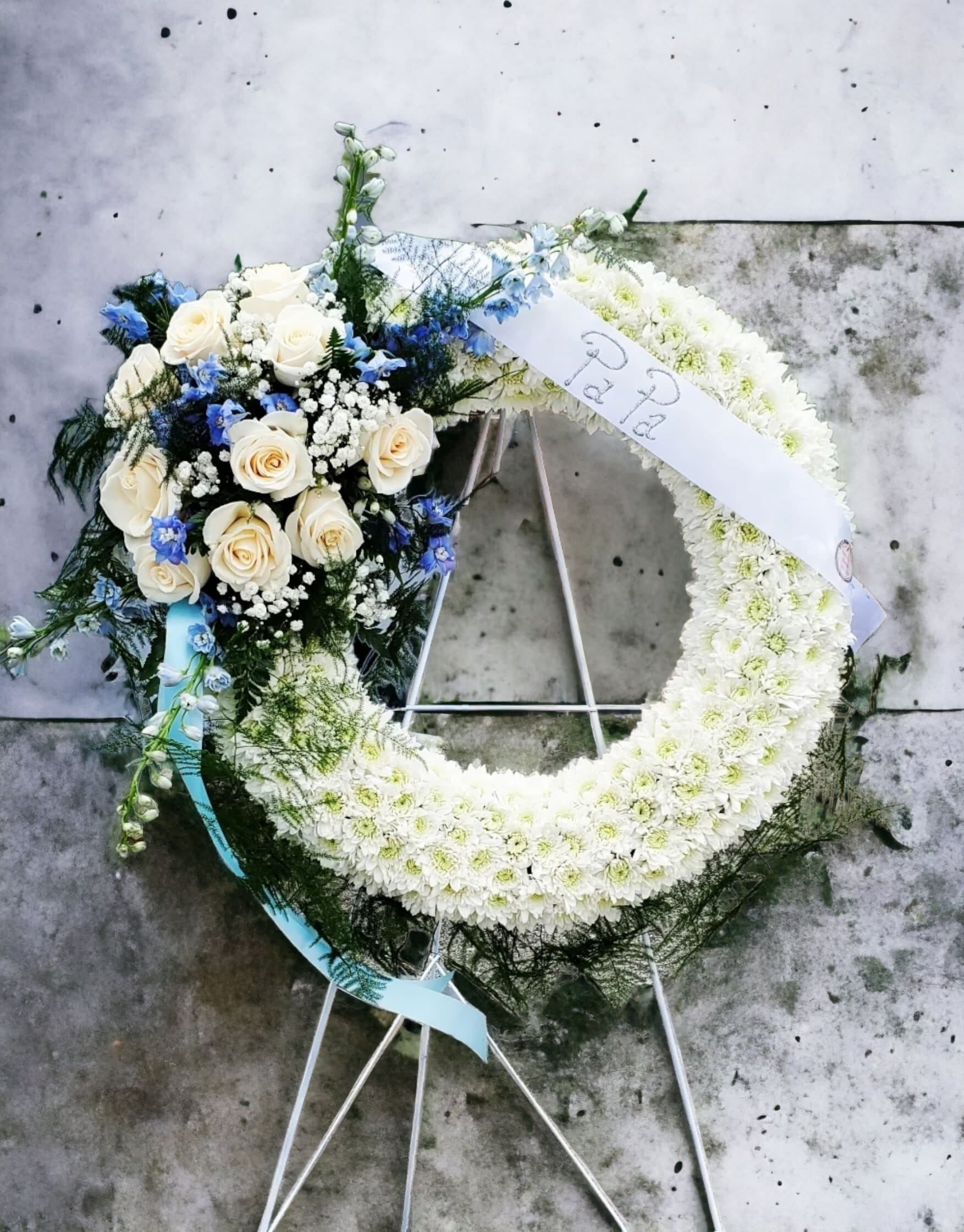 Wreath of Blue Sympathy Wreath of Blue Sympathy - This wreath is for the blue lovers, a color that is special in nature just like your loved one was special to you.