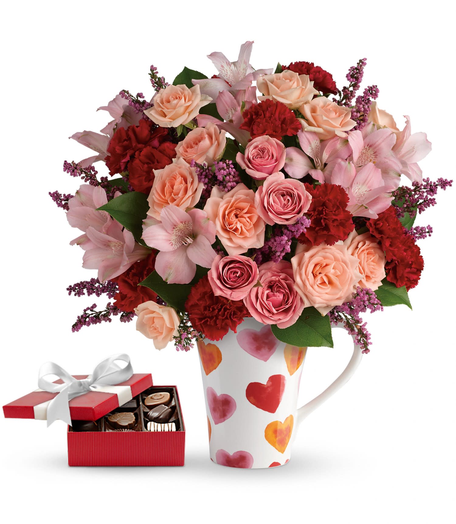Lovely Hearts Bouquet with chocolates DX - This lovely gift set includes a delicious box of chocolates paired with a stunning bouquet. Cheerful, hand-applied watercolor hearts dance across this darling oversized food-safe mug, sending your wishes for a delightful Valentine's Day! Filled with a sweet array of peach, pink and red blooms, it's a heartfelt gift they'll enjoy today and sip from happily for years to come! Delivered with a box of chocolates.