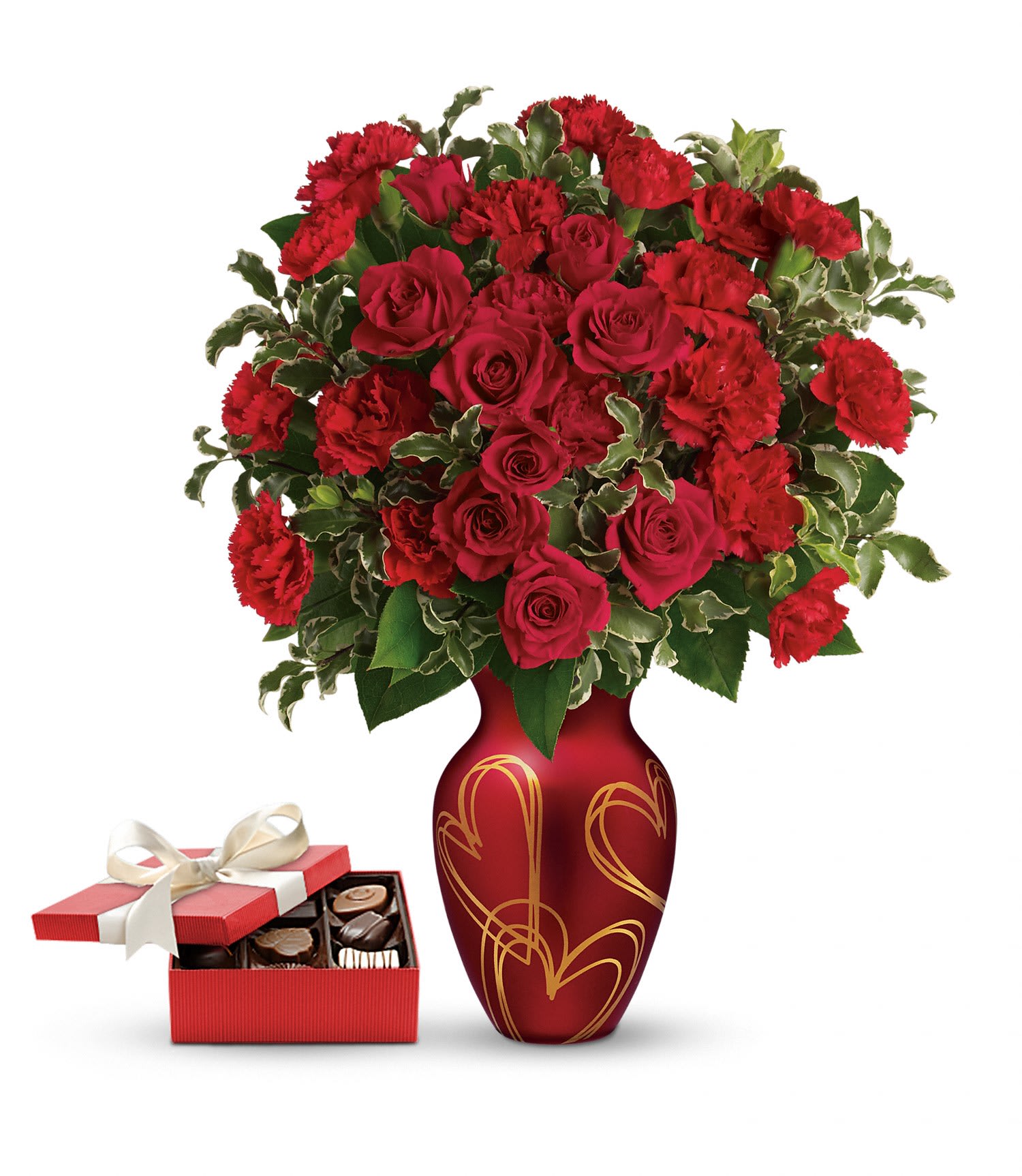 Hearts Of Gold Gift Set Hearts Of Gold Gift Set - This sweet gift set includes a delicious box of chocolates paired with a stunning bouquet. Golden hearts and red roses are the perfect recipe for Valentine's Day bliss! Surprise someone special with this delicate arrangement of red roses and carnations, hand-delivered in a rich red vase with gorgeous satin finish, adorned with golden hearts and a box of chocolates!