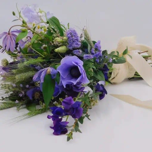 Lovely Lavender - The Lovely Lavender Bouquet is for the woman that follows her dreams and can make them come true. This beautiful mixed arrangement features elegant and fresh flowers that are the perfect gift for that special and unique woman in your life.    The bouquet pictured reflects our original design for this product. While we always try to follow the color palette, we may replace stems to deliver the freshest bouquet possible, and we may sometimes need to use a different vase.    We have a simple goal – delight our customers with flowers that are high quality, fresh, and beautiful. While we may occasionally need to substitute for color or flower variety, we promise that the blooms you receive will be fresh and wow you or your gift recipient. 