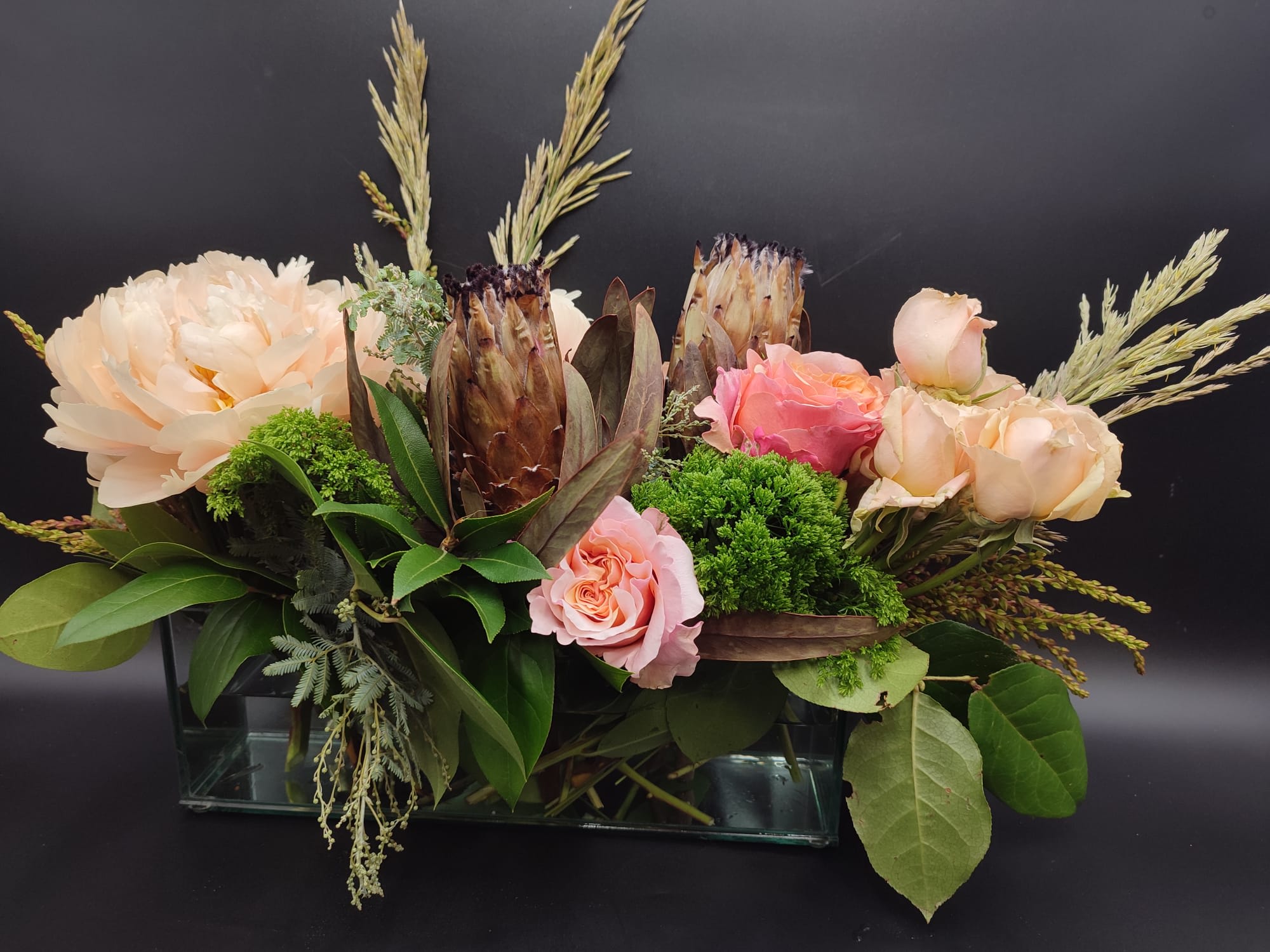 November Rain  - The bouquet pictured reflects our original design for this product. While we always try to follow the color palette, we may replace stems to deliver the freshest bouquet possible, and we may sometimes need to use a different vase.   We have a simple goal – delight our customers with flowers that are high quality, fresh, and beautiful. While we may occasionally need to substitute for color or flower variety, we promise that the blooms you receive will be fresh and wow you or your gift recipient.