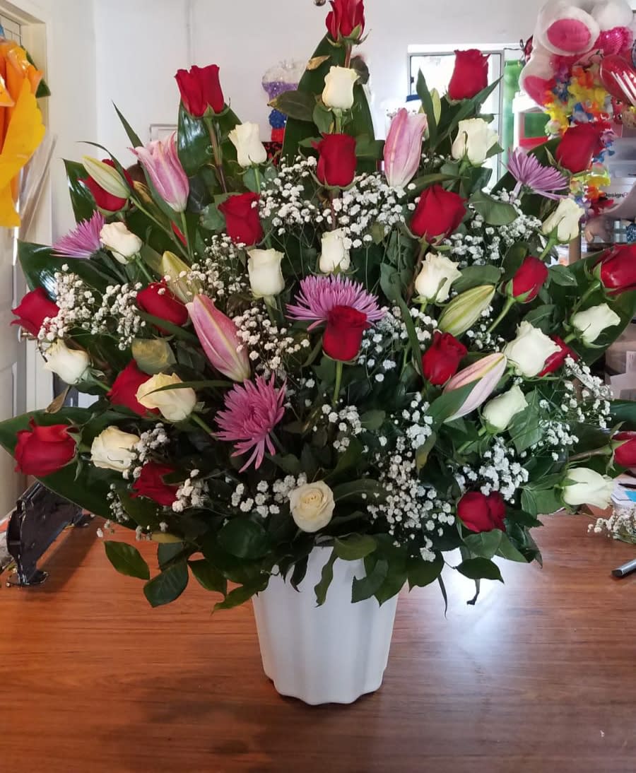 Normys#14 - 36 Red and white Roses Lilies  Baby's breath and Greenery in white Basket 