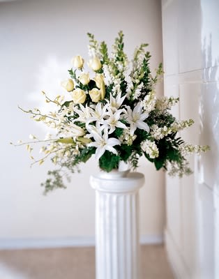 In Your Honor Arrangement In Your Honor Arrangement - Bursting forth like a thousand stars, this arrangement of lilies, roses, orchids and more is impactful and sophisticated. Appropriate to send to the funeral home. Approximately 32H" X 40W"