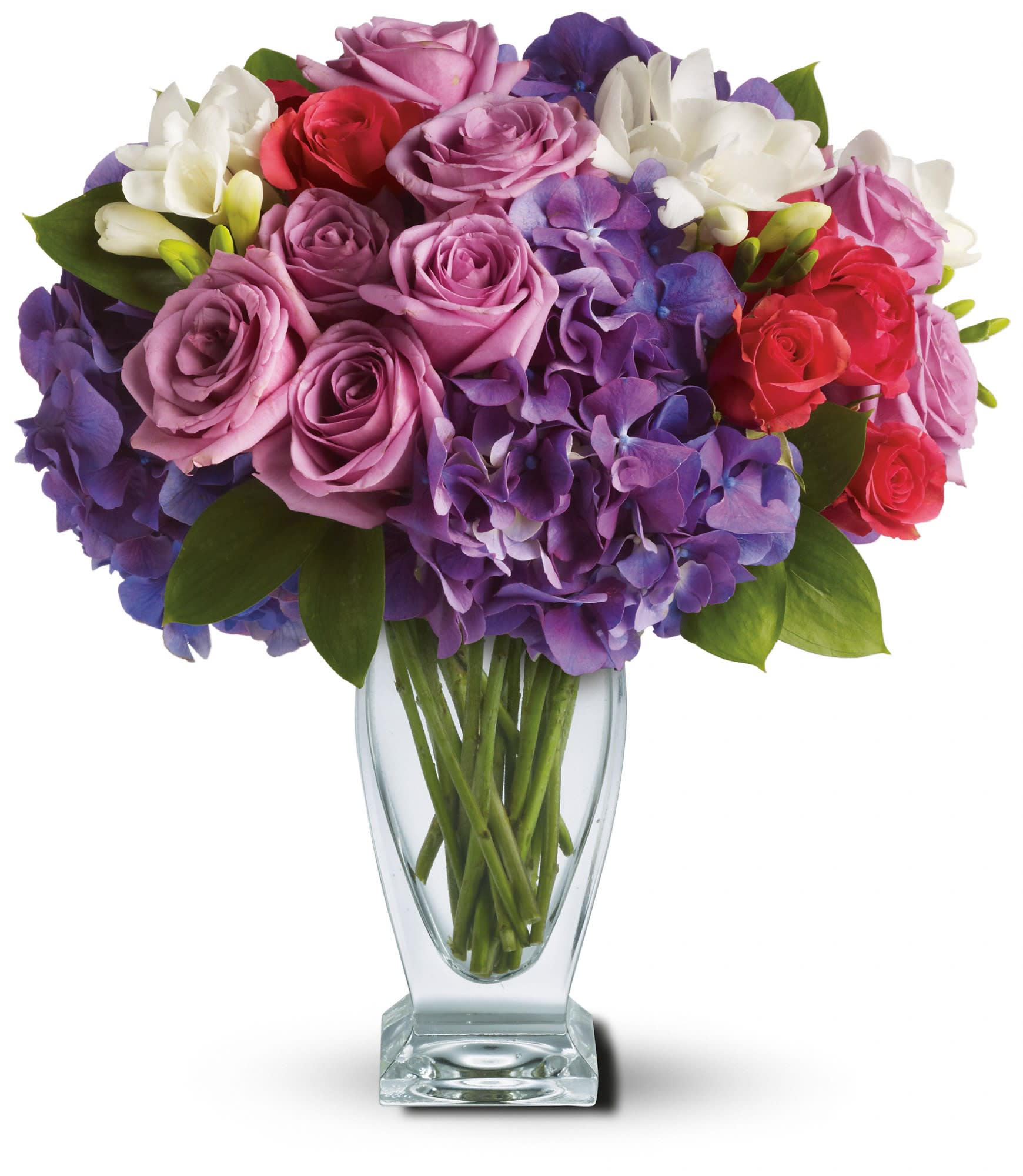 Rhapsody in Purple - A rhapsody of beauty is on stunning display in this arrangement. Gorgeous blossoms are beautifully arranged and delivered in a divine Couture Vase.  Purple hydrangea, lavender roses, hot pink spray roses and white freesia arrive in style! Approximately 12 1/2&quot; W x 13 1/2&quot; H  