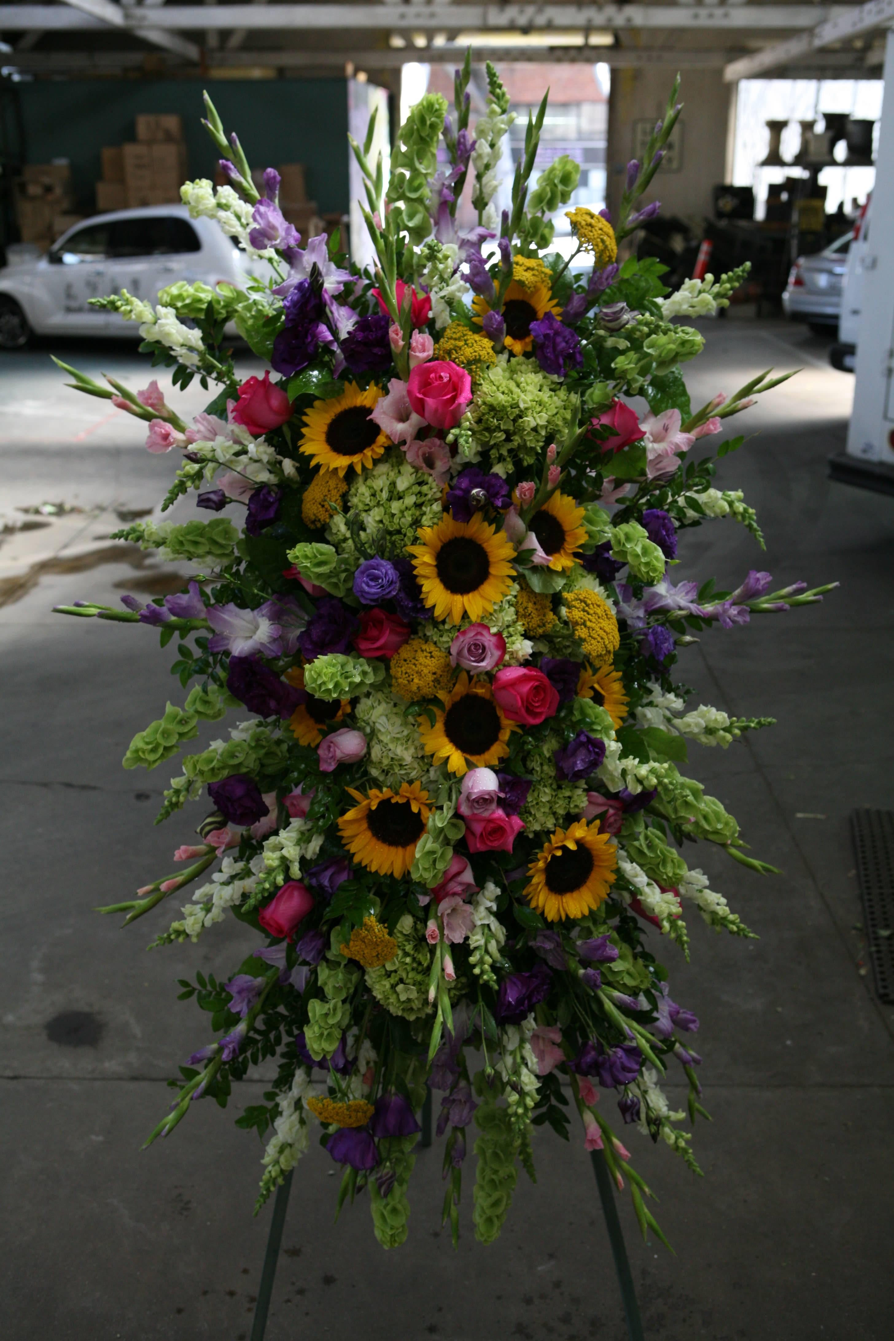 Standing Spray Designers Choice  - An extravagant display of seasonal flowers.