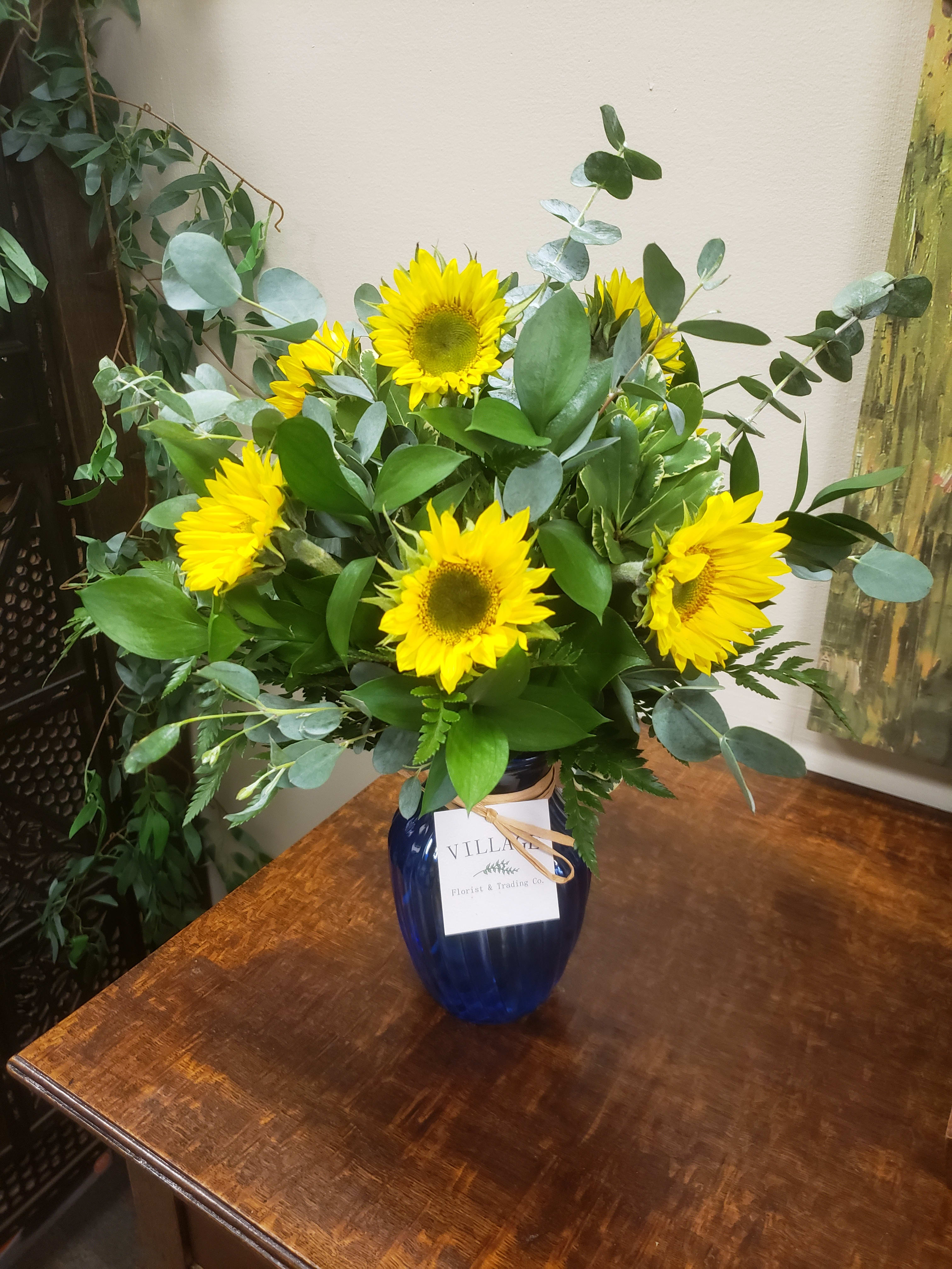 Van Gogh's Sunflowers - Beautiful Sunflowers and Mixed Greenery tastefully arranged in a cobalt vase. Please contact our shop directly for Special Requests, Advance Orders and Custom Funeral Arrangements. We are always glad to accommodate. Call 732-341-3723 or email Danielle at thevillagefloristnj@gmail.com.