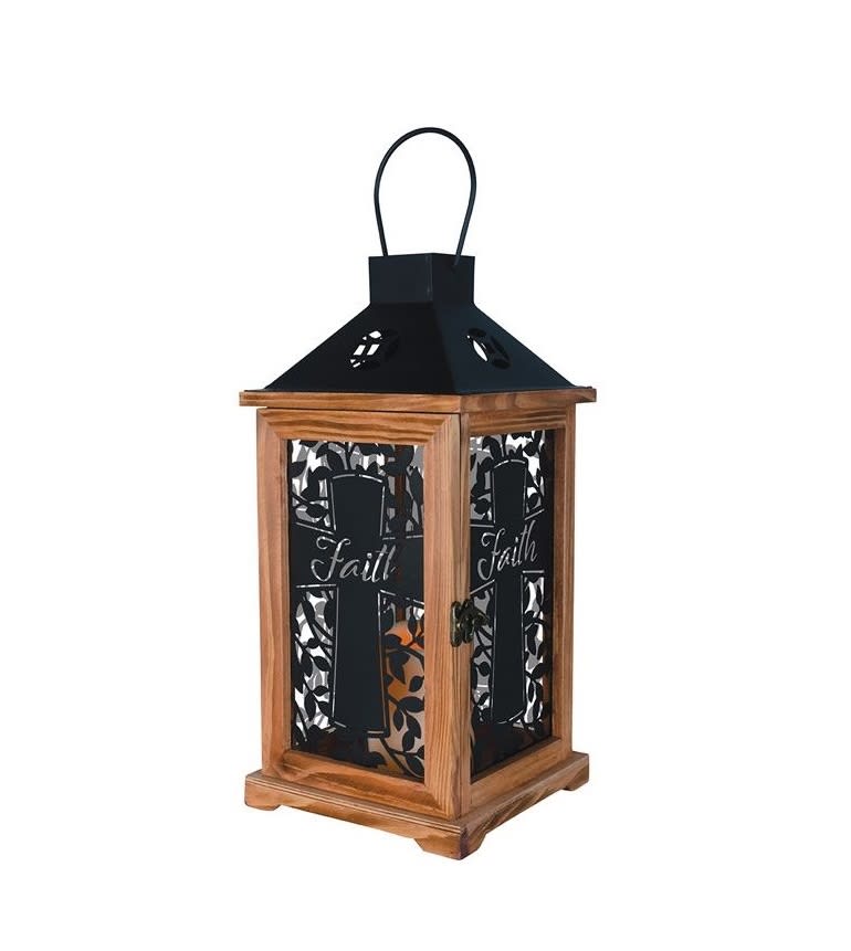 &quot;Faith&quot; Silhouette Lantern - This lantern has black metal walls that cast the silhouette of a cross with the word &quot;Faith&quot; inscribed in it when illuminated. Our Memorial Lanterns are made from quality composite wood and a metal finish top. They are 16&quot; tall and feature a built-in automatic timer which runs for 6 hours on and 18 hours off. It can be purchased individually or with an accompanying floral arrangement (Deluxe).