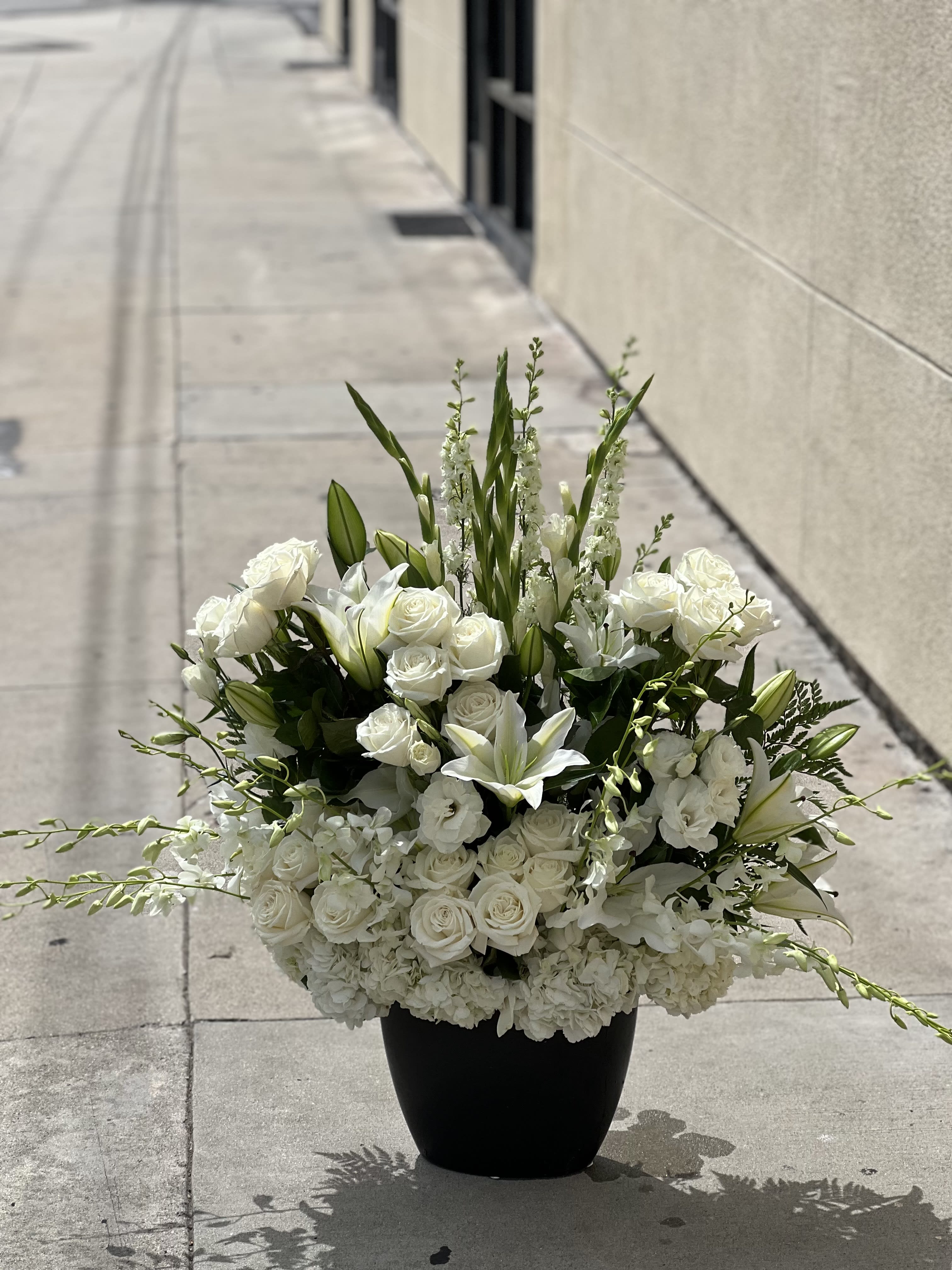 white tall  - mix of white with a ceramic vase 