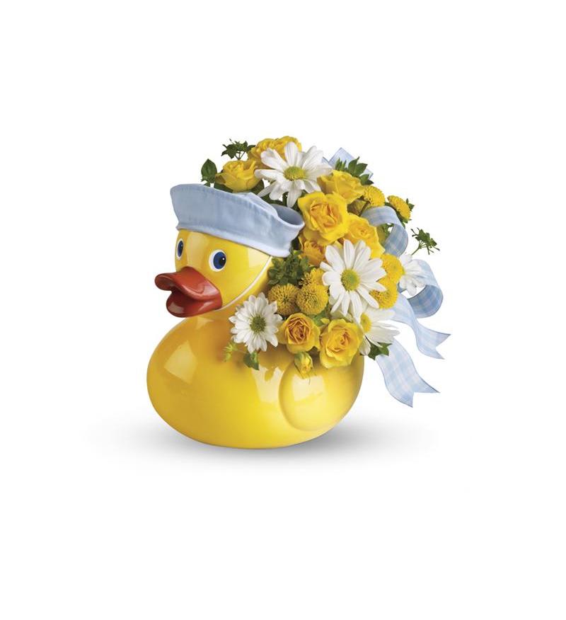 Teleflora's Ducky Delight   - This adorable arrangement takes to baby showers and baby arrivals like a duck takes to water! Available in boy and girl versions, this charming arrangement in its cute and reusable keepsake container is, well... just ducky! Approx. 10 1/2&quot; W x 11&quot; H 