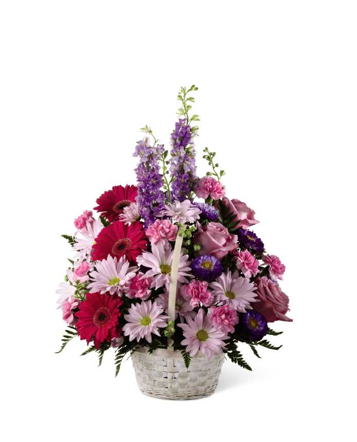 The FTD Pastel Peace Basket - The FTD Pastel Peace Basket is a sweet and simple way to offer your condolences. Lavender roses, fuchsia gerbera daisies, lavender daisies, purple larkspur, purple matsumoto asters, pink mini carnations and lush greens are arranged to perfection in a round whitewash handled basket to create a gift that expresses your wishes for sympathy and peace.