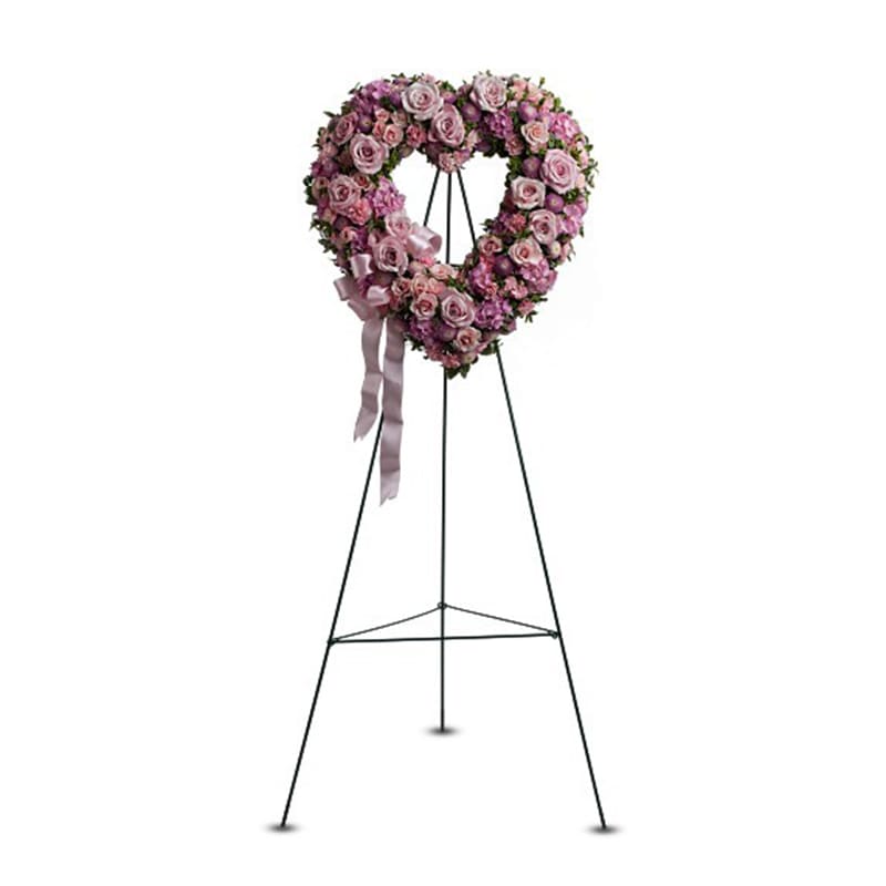 Rose Garden Heart Rose Garden Heart - The heart is a universally recognized symbol that expresses love, devotion and affection. And this Rose Garden Heart flower arrangement � created with a dozen pink roses, plus mixed flowers in shades of pink � will express your heartfelt thoughts to everyone in attendance. A heart-shaped standing spray created from a dozen pink roses, plus mixed fresh flowers such as hydrangea, miniature carnations and roses and button spray chrysanthemums � accented with greenery � is delivered on an easel. Approximately 18" (W) x 19" (H) (Dimensions do not include easel.)