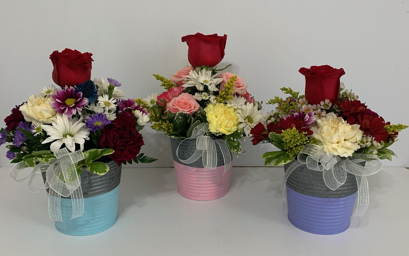 Thank You Bouquet - Colorful arrangement with roses, daisies, carnations and filler in different colored tin pots, if you have a preference of color please specify it and we will use that color if we have it available. Great for Admin Day, Teachers Gift or just to say Thank You!
