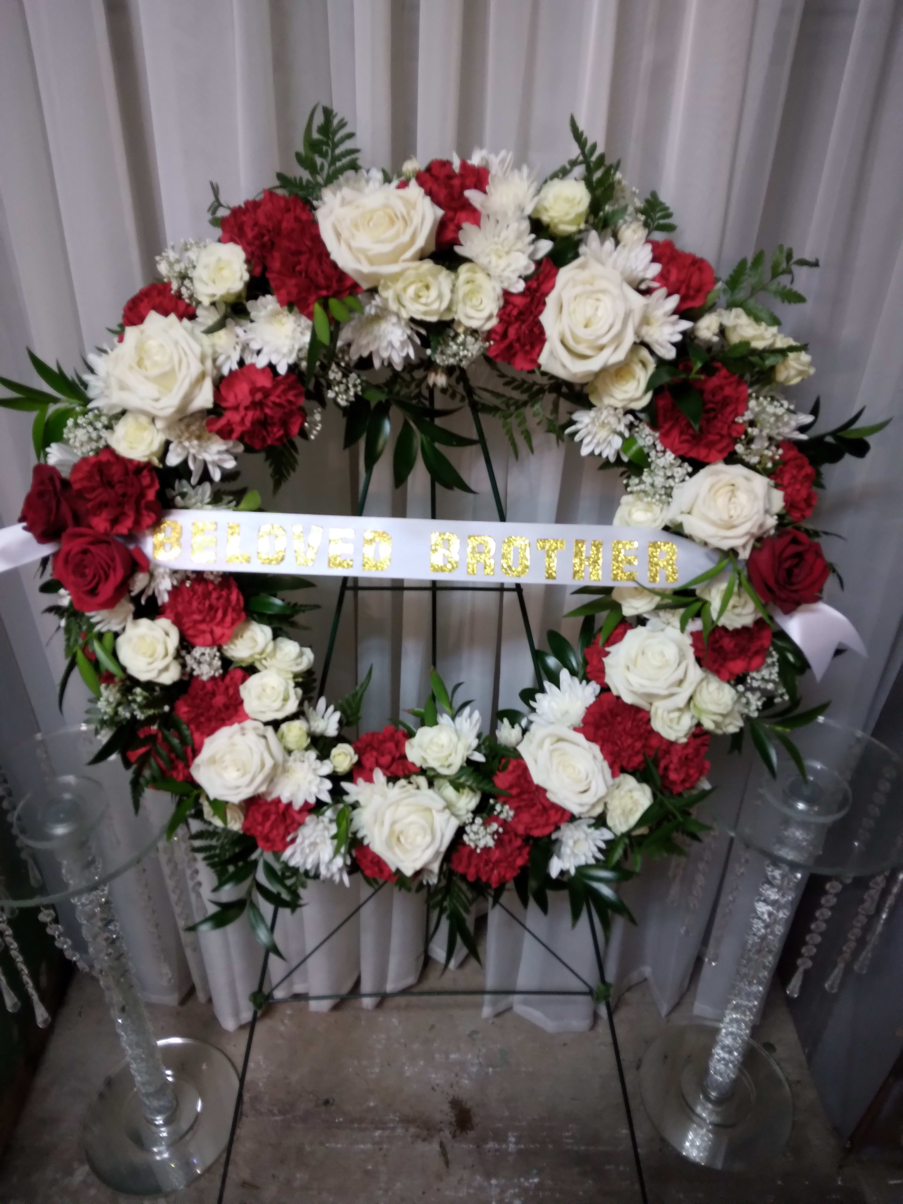 Andrew's Memory Wreath - Open wreath for eternal love with red and white flowers. Color scheme can be customized and banner in center will have 2 words max. Make any changes you need in special instructions. 