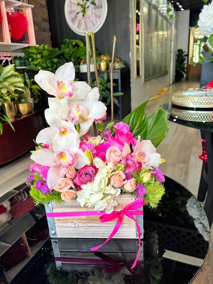 Summer Splendor - Wooden Box with Luxe Roses, Cymbidium Orchids and Mixed Flowers.
