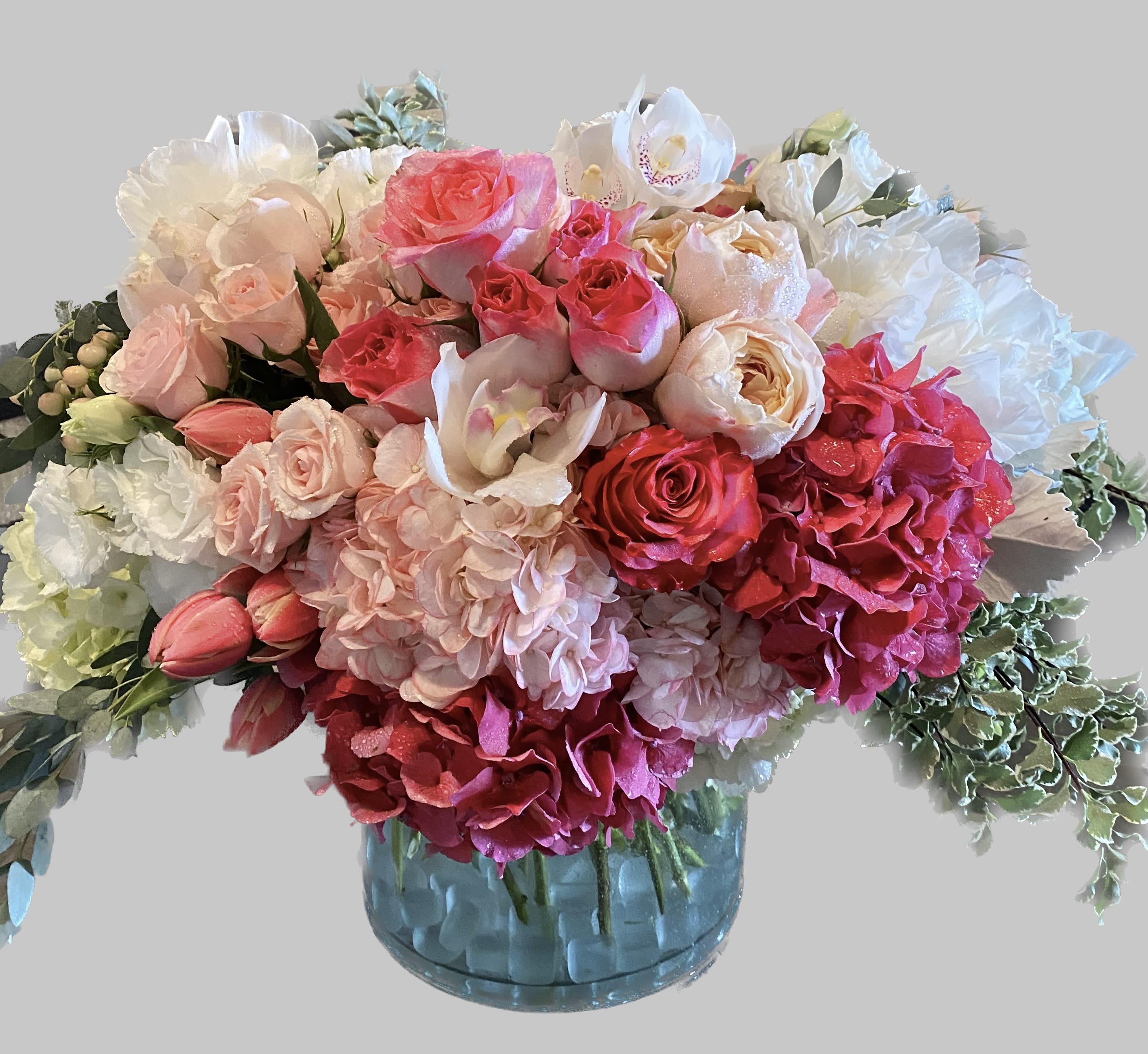 Time to celebrate  - No matter what you're celebrating, this is a perfect gift to wish someone praise or honor their new beginnings. This arrangement contains Pink roses white cymbidium and Hydrangea.