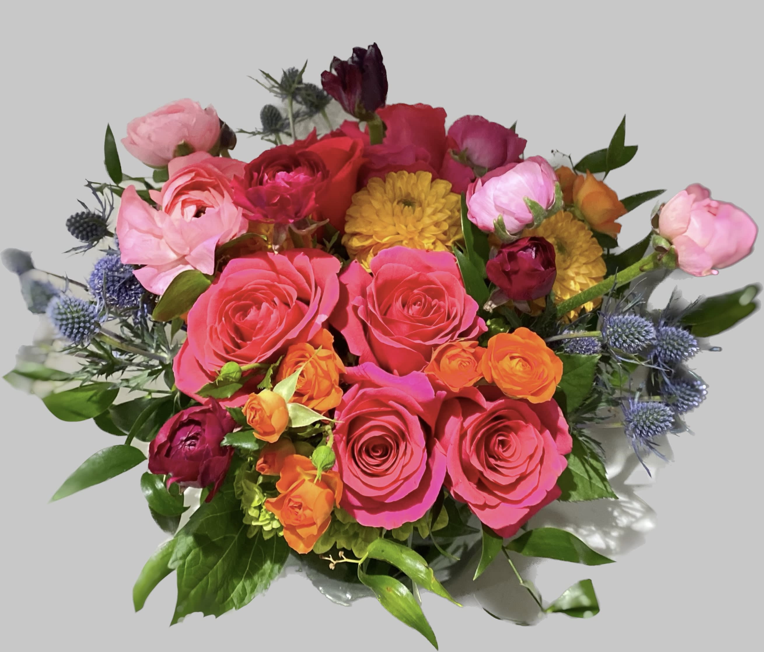 Diana - A full-color explosion, This arrangement is a beautiful gift for anybody you want to impress. Mother-in-law, your boss, a client, etc... this arrangement is a crowd pleaser and an eye-catcher.