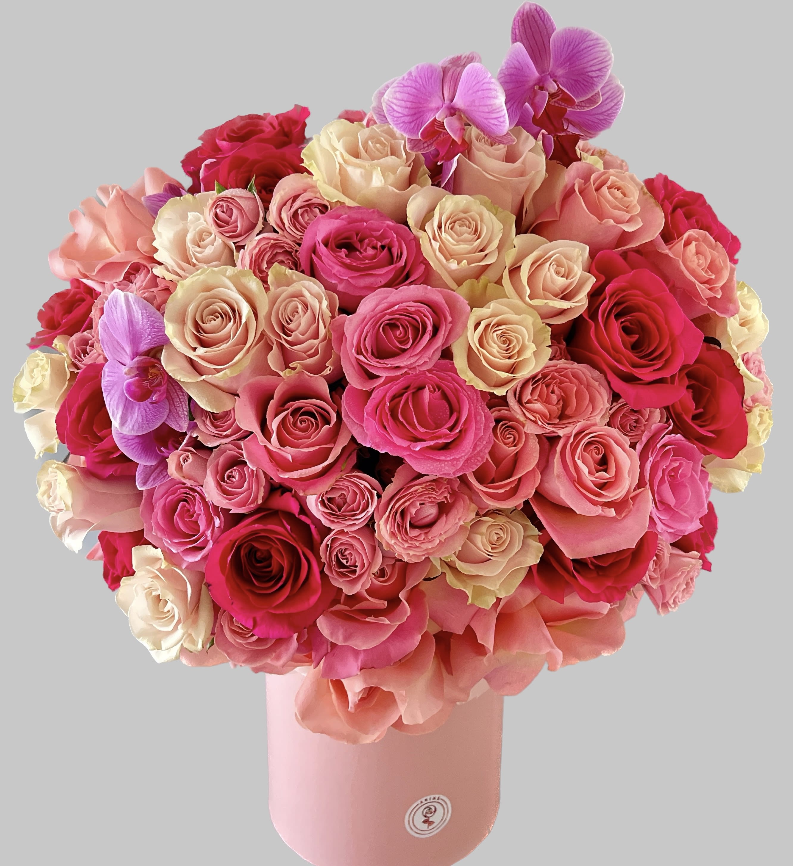 Gorgeous roses within hat box - Gorgeous arrangement in a pink hat box with pink shade colored roses, and hydrangeas. Would look amazing on any where . 