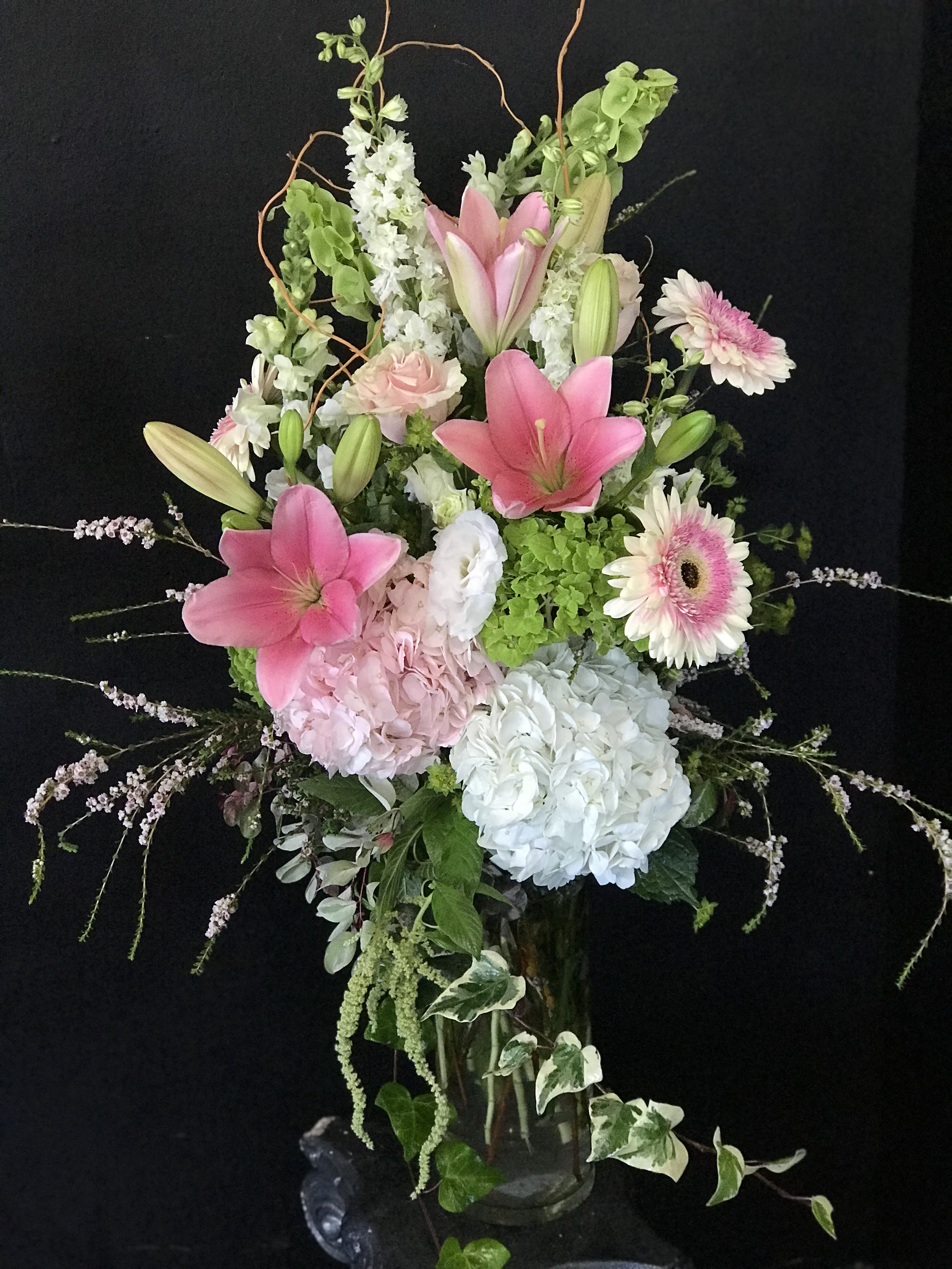 wonderful pink - green and white hydrangia with pink lily and pale pink gerbara dasie