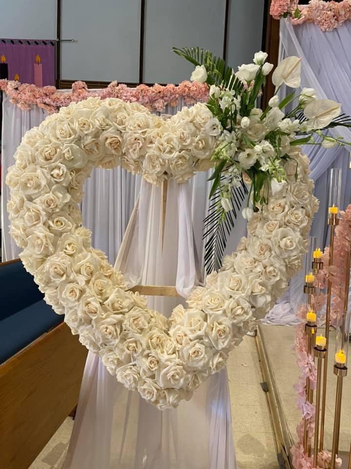 Open heart open roses custom made all white roses - he Grand Heart Sympathy Arrangement with all-white roses is more than just an arrangement; it's a tribute woven from compassion, empathy, and shared sorrow. As the white roses come together in a symbol of purity and reverence, they offer a source of comfort to those who mourn, reminding us that even in times of loss, love remains eternal.