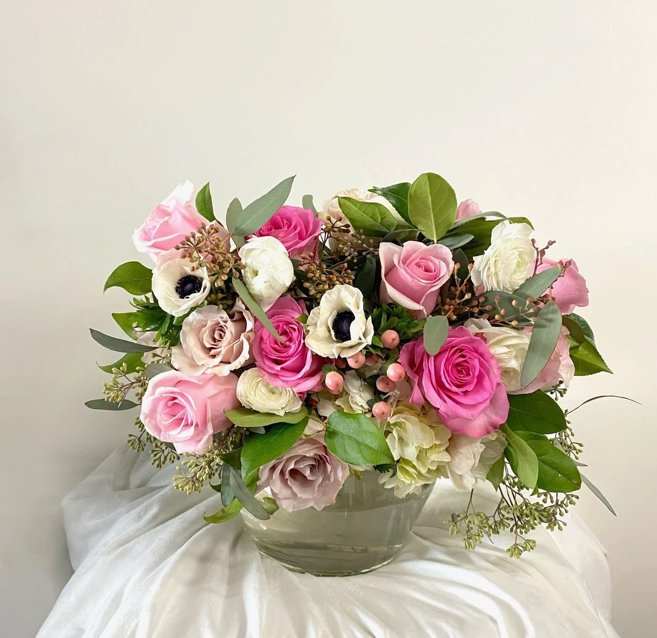 Designers Choice in Pink - Tell her you love her with a romantic array of pink and white flowers in a vase. Flower options are at the discretion of the designer and will reflect the look and feel of the picture. Delivery or pick up is available.