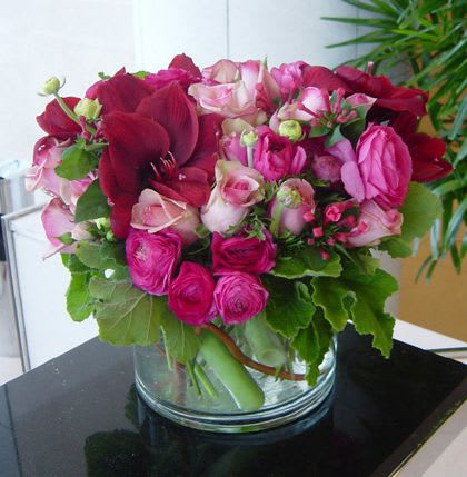 Pretty in Pink  - Send this beautiful seasonal mix in a compact design in a low cylindrical vase. Flower types will vary depending on season.