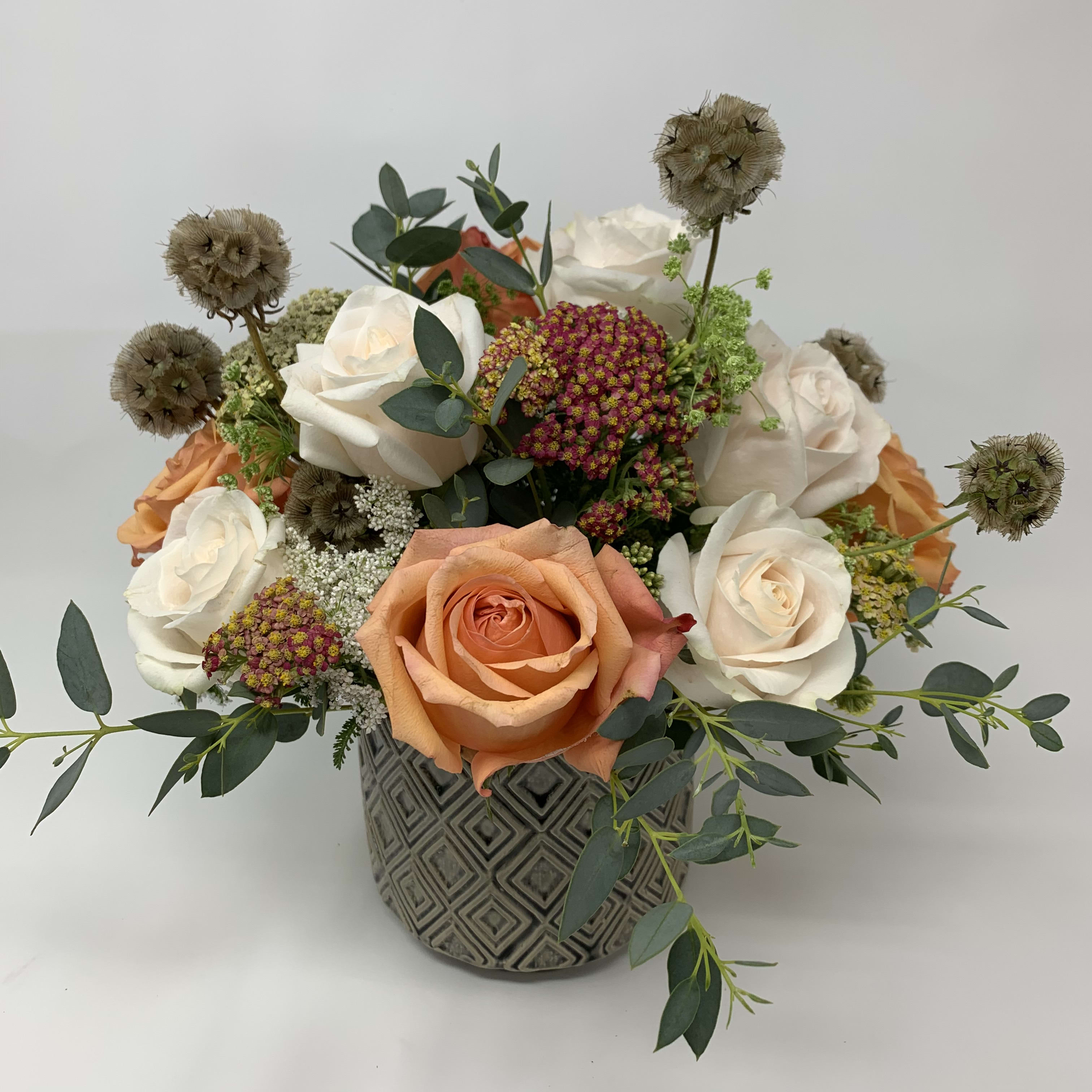 Neutral Meadow  - May contain white and peach roses with filler fitted into a vase.