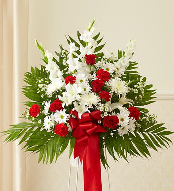 Red &amp; White Heartfelt Funeral Basket - When you want to convey feelings of love and remembrance, send this standing sympathy basket, beautifully arranged by our expert florists using only the freshest blooms. With red flowers to represent true love and white flowers to symbolize purity and honor, it’s a fitting choice to express all the emotions you’re feeling at this difficult time.
