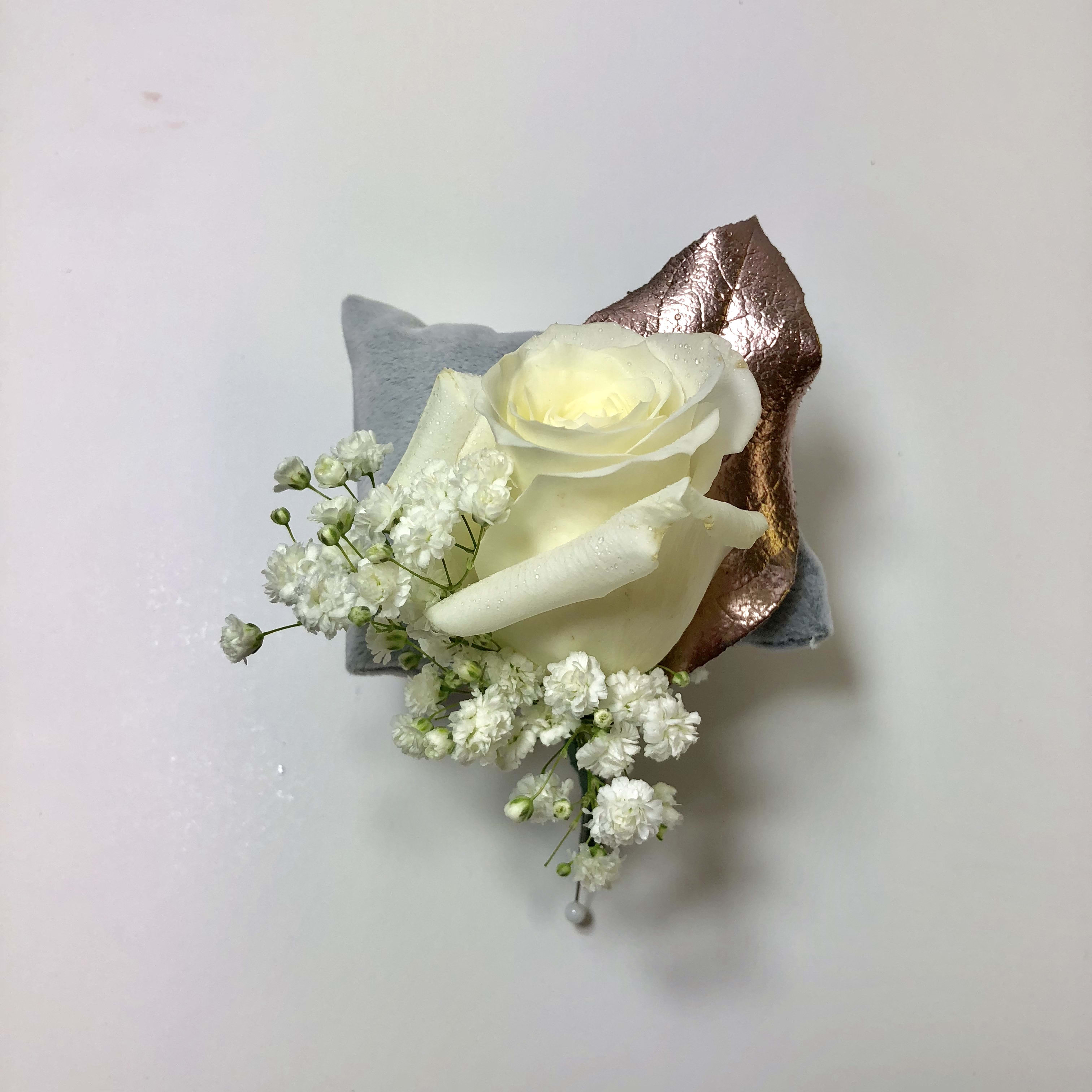 B11 White Rose Boutonniere with metallic accents  - White rose boutonniere for your gentleman.  This design shown with rose gold leaves.  Each boutonniere is customized to coordinate with his date's flowers and amazing dress.    