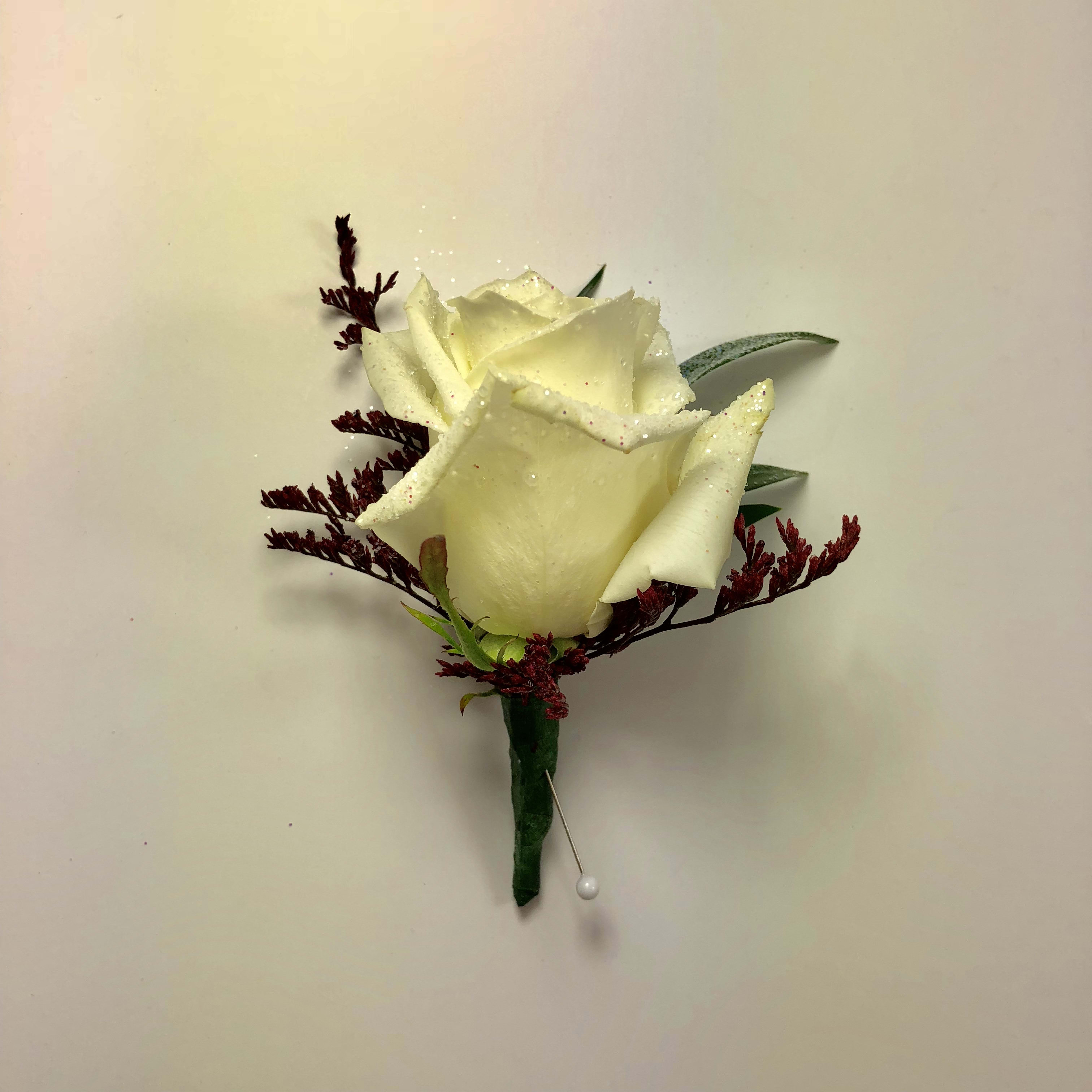 B13 Rose boutonniere  - Rose boutonniere with color added.  The foliage is sprayed to match his date's dress.  Each design is customized for each order and your date's beautiful dress.