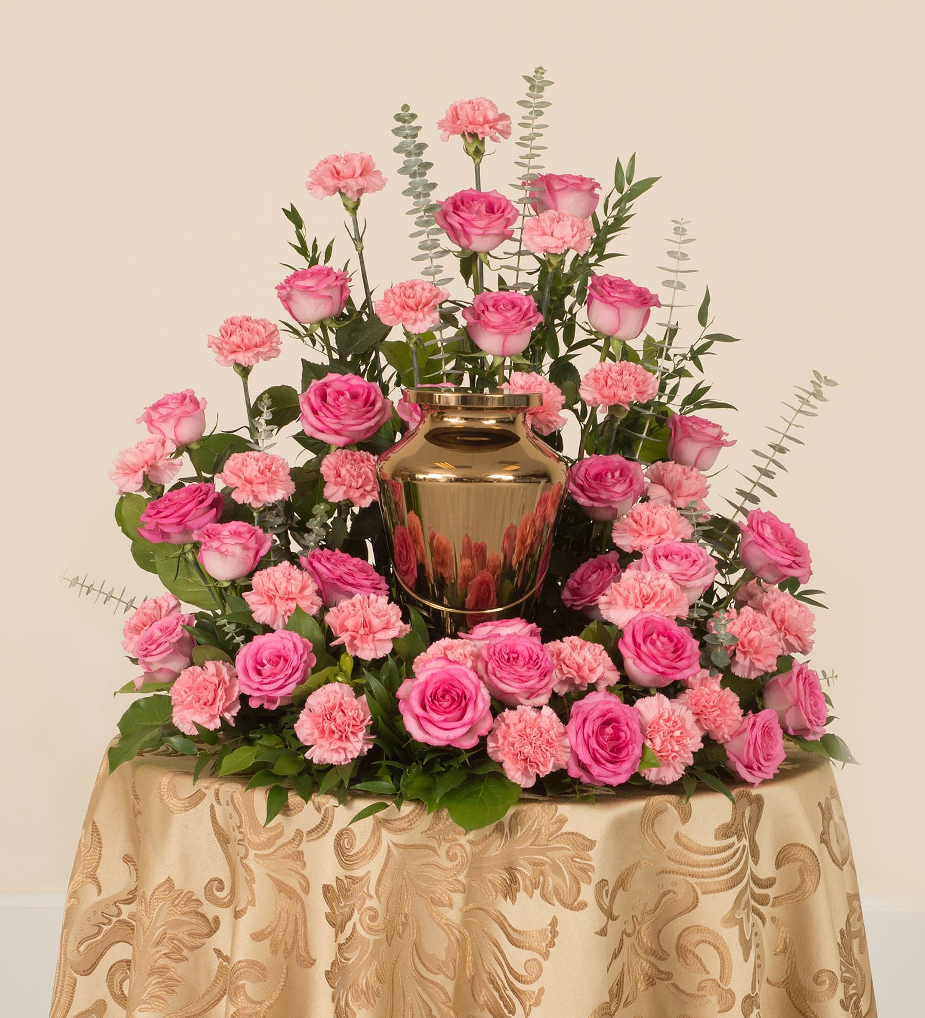Pink urn piece Pink urn piece - This pink Urn piece is a loving memorial for a mother, grandmother or any woman loved by you. Full of roses, carnations, eucalyptus and other greenery, this is a truly special way to honor your loved one. (Color can be customized when available)