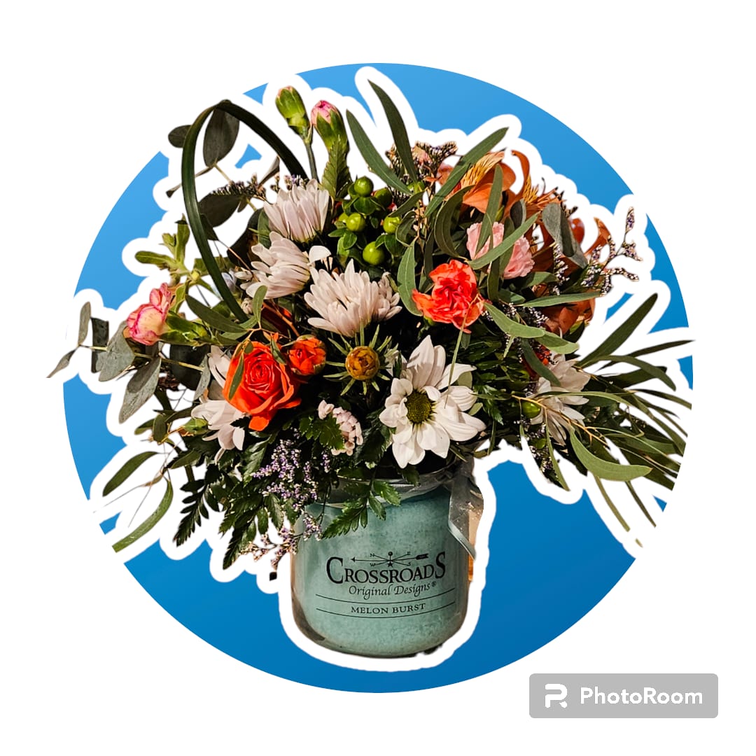 Crossroads Candle Arrangement - We pick out a candle and put an arrangement on the top of it. The flowers we pick out will go well with the candle color. 