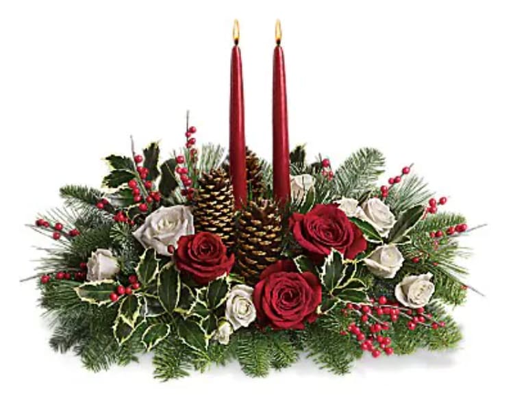 Christmas Wishes Centerpiece - Elegant. Lovely. Radiant. This beautiful Christmas centerpiece is everything you could wish for and more. Stunning red and white roses, white spray roses and chrysanthemums plus all of your holiday favorites like pinecones, berries, holly, Christmas greenery and two tall-tapered candles. A brilliant way to send your Christmas wishes in style.   Orientation : All-Around  All prices in USD ($)  Standard  T127-1A  Deluxe  T127-1B  Premium  T127-1C  4th of July Flowers Delivery - Send 4th of July Flowers 