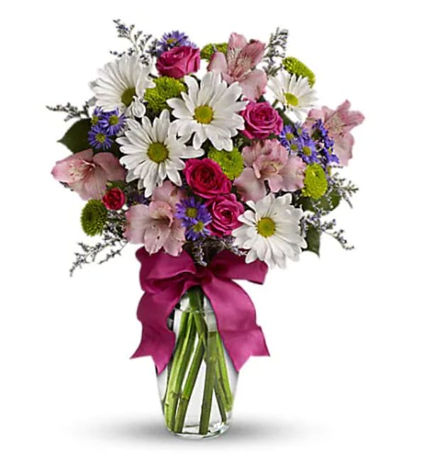 Pretty Please Pretty Please - Looking for the prettiest bouquet in town? We've got the perfect all-around choice - a mix of blooms in breezy shades of pink, white, lavender and more, all tied up with a big pink bow! A great way to make someone smile. A mix of fresh flowers such as spray roses, daisy and button spray chrysanthemums, Monte Cassino asters and limonium, in shades of white, pink, green, purple and lavender. Delivered in a vase adorned with a matching ribbon. Orientation : All-Around All prices in USD ($) Standard TEV12-4A Deluxe TEV12-4B Premium TEV12-4C