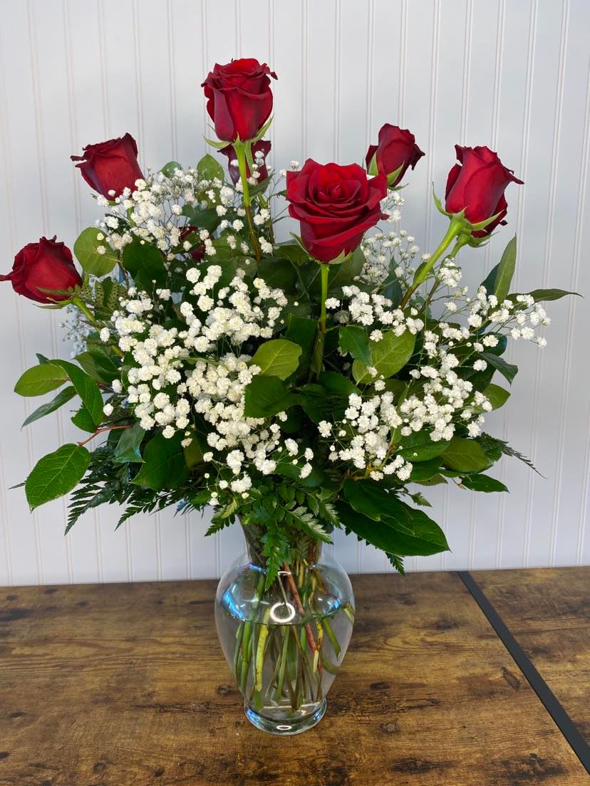 Dozen Red Roses - Our standard bouquet comes with 12 red charming roses, baby's breath, leather leaf fern.