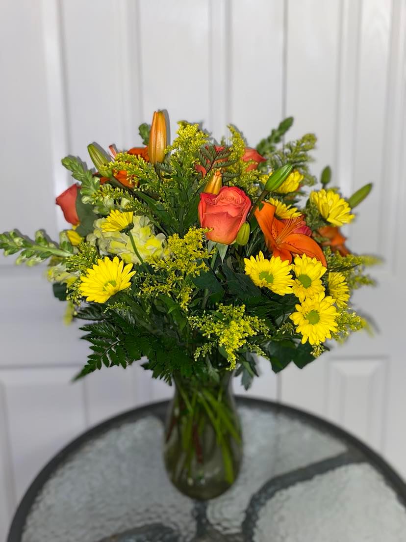 Spring Morning - For a beautiful morning arrangement features Gerberas, roses, snap dragons, daisies, solidaster flowers.