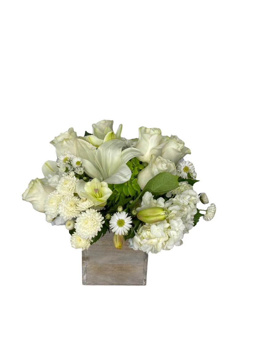 Truly Miss You - This arragement comes in a wooden box it features beautiful white Lilies, white Roses, amazingly beautiful Hydrangeas. dots, Monte Casino flowers  For the truly missed person in your life....