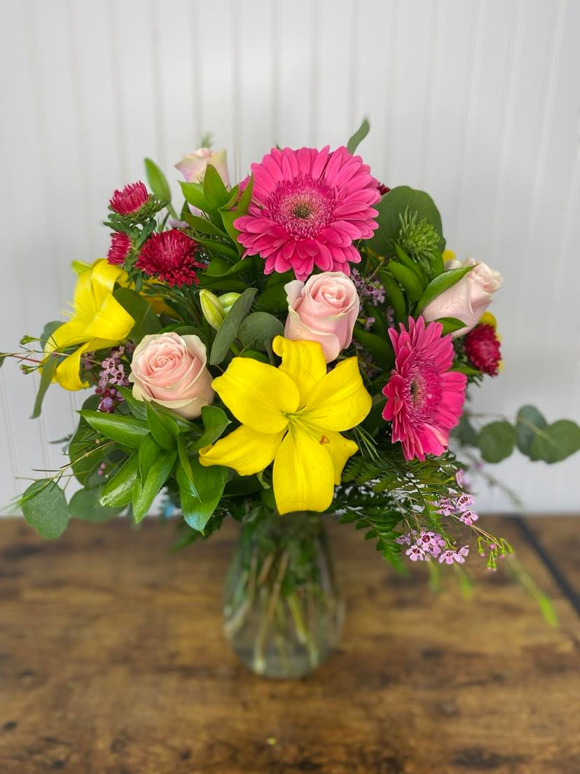 Sweet Spring Sweet Spring - A breath of fresh air, features pink Gerbera, Yellow Lilies, Pink Roses with eucalyptus leaves and wax flowers
