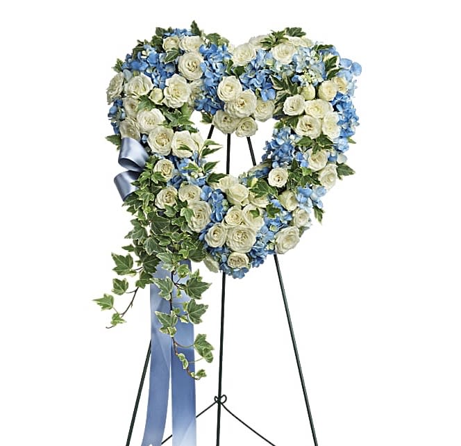 Pure Heart - Adorned with trailing ivy, this petite, 18&quot; sweet heart-shaped wreath of sky blue hydrangea and pure white roses is a loving remembrance.