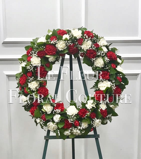 Crimson &amp; White Carnation Wreath - A beautiful wreath of crimson red and white carnations, accented with babies breath and various greens.