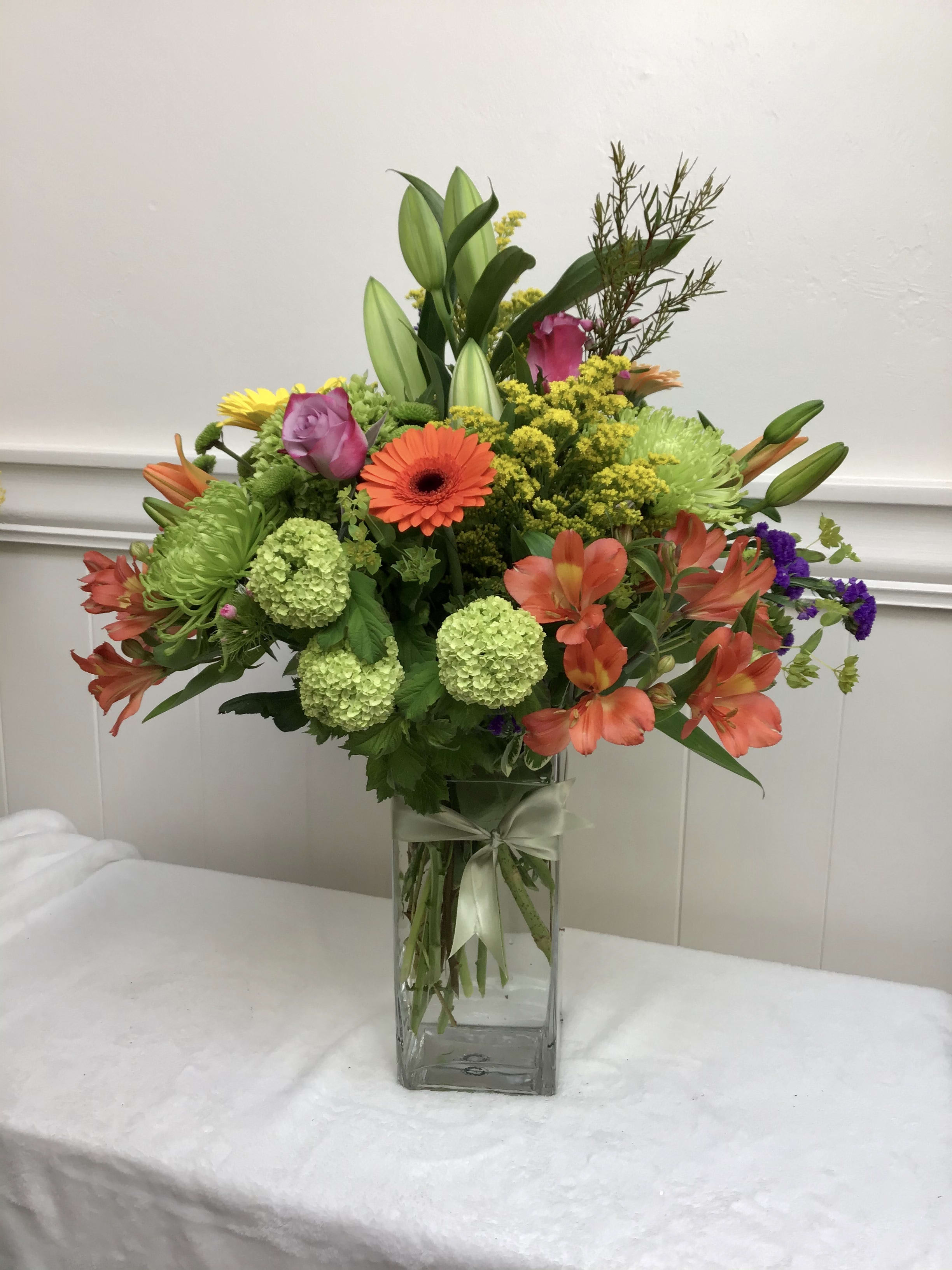 Bright and Colorful -Large - We will use colorful seasonal flowers to create an exceptional arrangement.  *flowers, colors, and vase will vary* *arrangements pictured are $150*