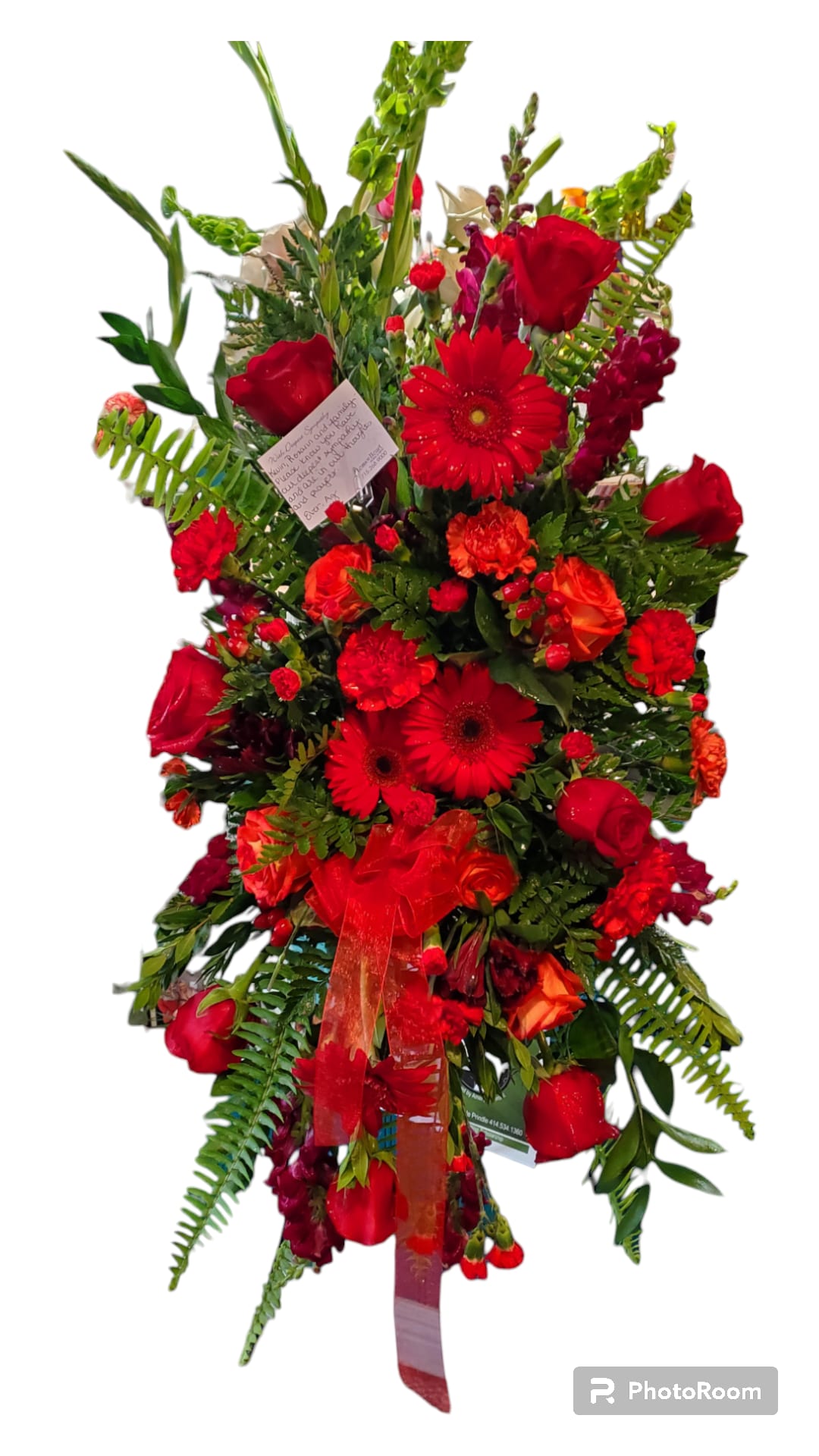 Red Easel  - A mix of red flowers arranged on an easel. 