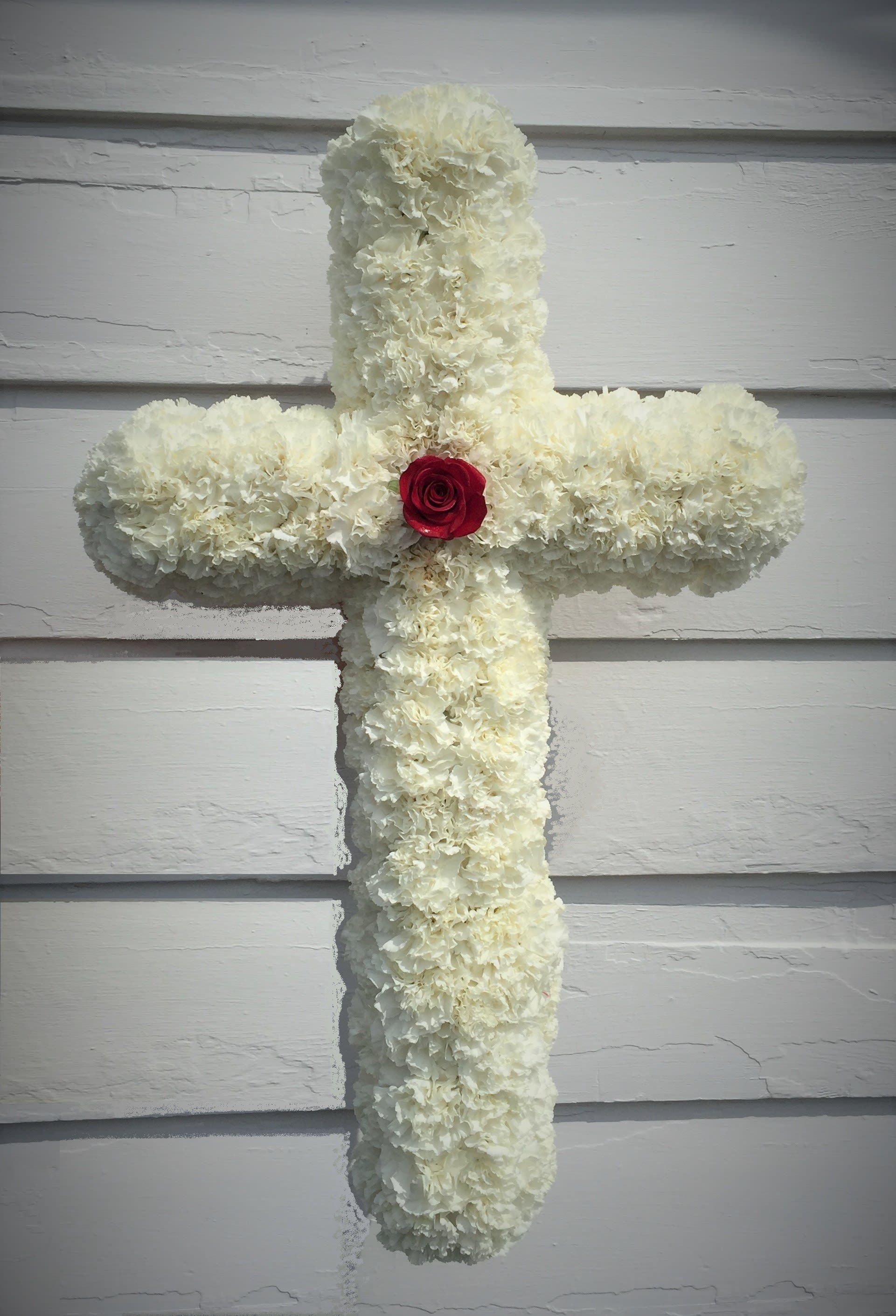 remembering with Faith - 28&quot; Cross with all white carnations and 1 red rose