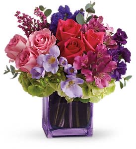 Teleflora's Exquiste Beauty  - No other name could possibly describe this exquisitely beautiful bouquet. Its brilliant blossoms are gorgeously arranged and delivered in an exclusive lavender vase. Let her know how special she is to you by sending this fabulous gift.