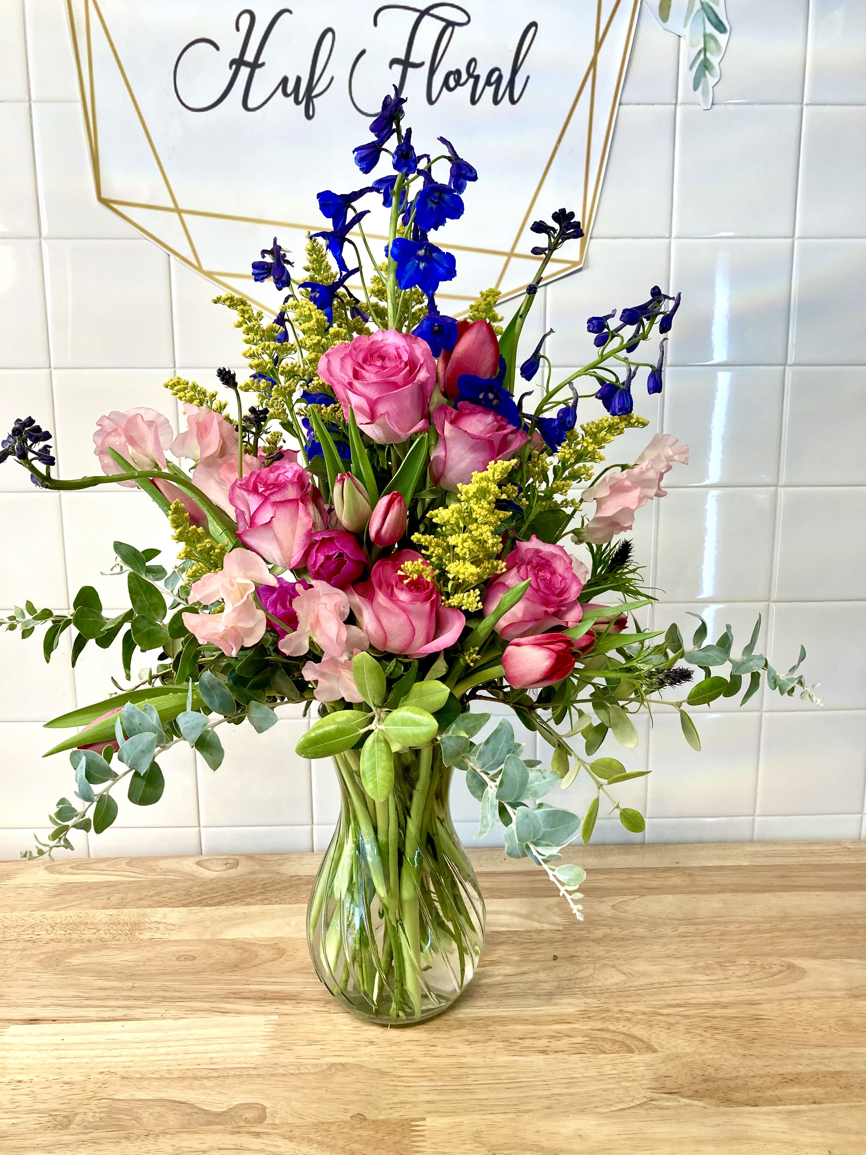 Timeless Beauty Timeless Beauty - Mix the Timeless Beauty of Lipstick-Hued Spray Roses and Tulips with a few Blue Blossoms, and you’ll have this Beautiful, Blushing Bouquet that’s Colorful and sweet!